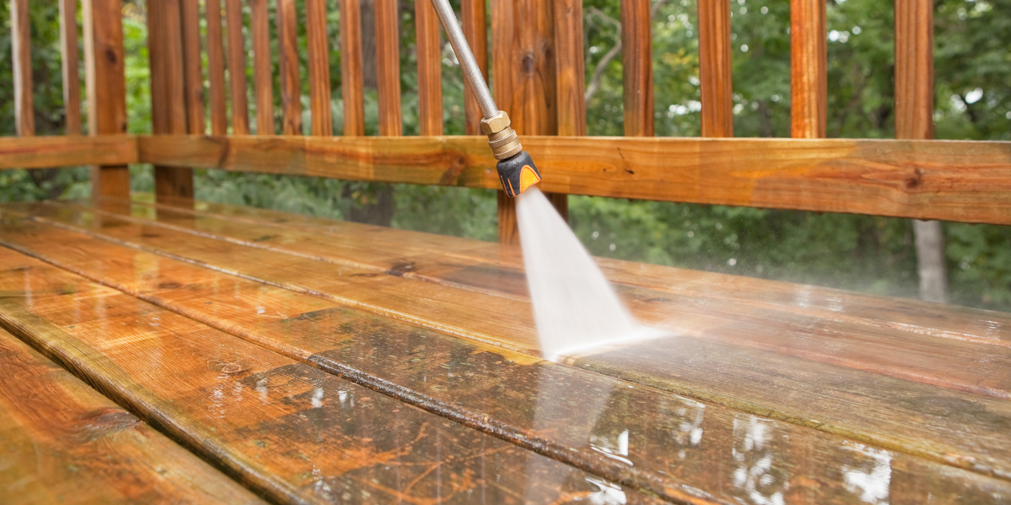 A wooden bench with a spray of water on it